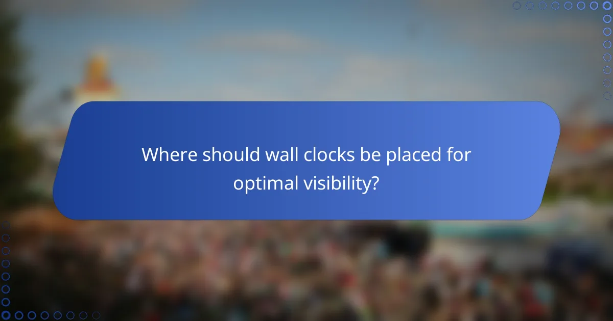 Where should wall clocks be placed for optimal visibility?